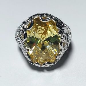 Elegant Silver and Yellow Gemstone Ring